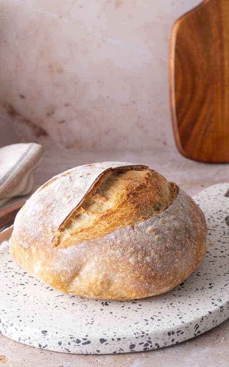 A nice ear lift on an uncut boule of everyday sourdough bread.
