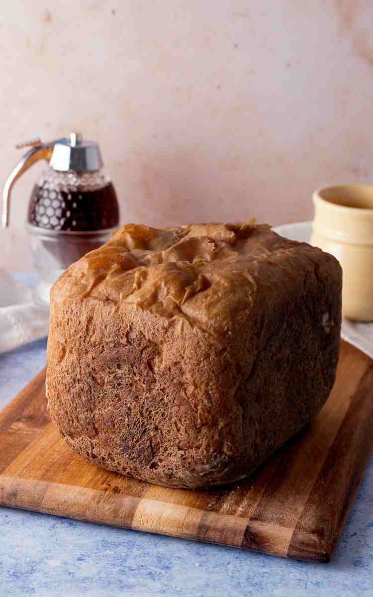 A whole uncut loaf of bread machine honey white bread.