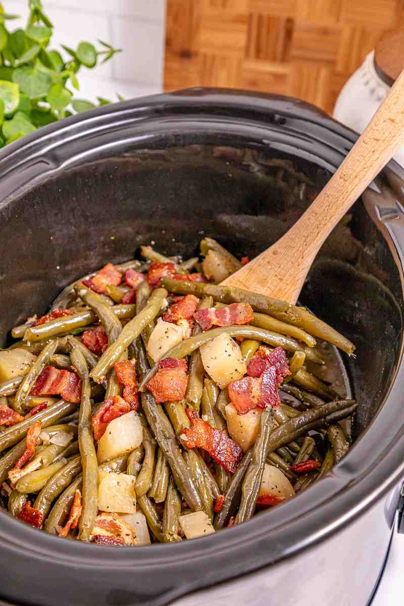 Angled view of southern style green beans and potatoes.