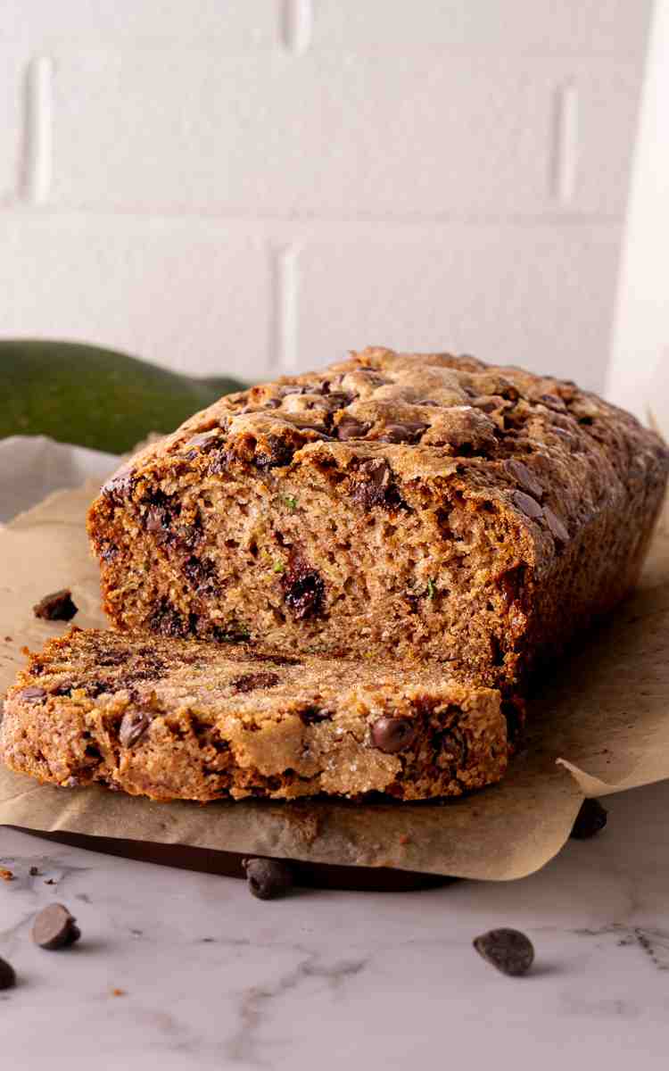 Easy zucchini bread with chocolate chips with a slice cut out of the loaf.