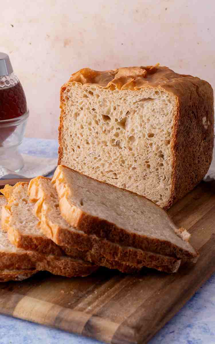 Honey White Bread sliced with flaky crust.