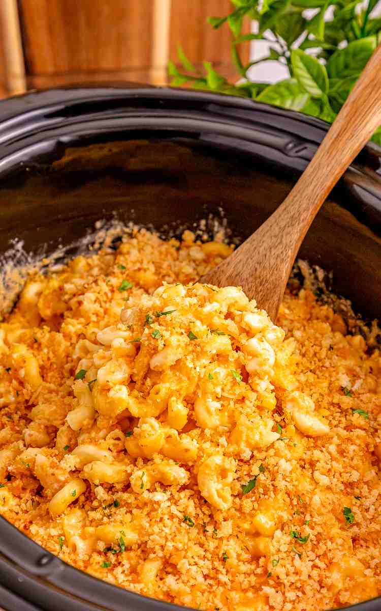 Mac and cheese in the crockpot topped with panko and parsley.