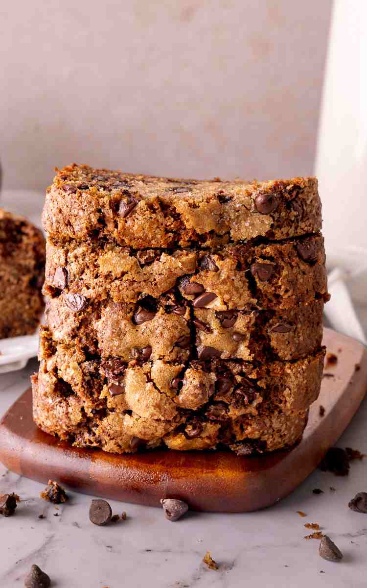 Quick bread with zucchini and chocolate chips stacked five high.