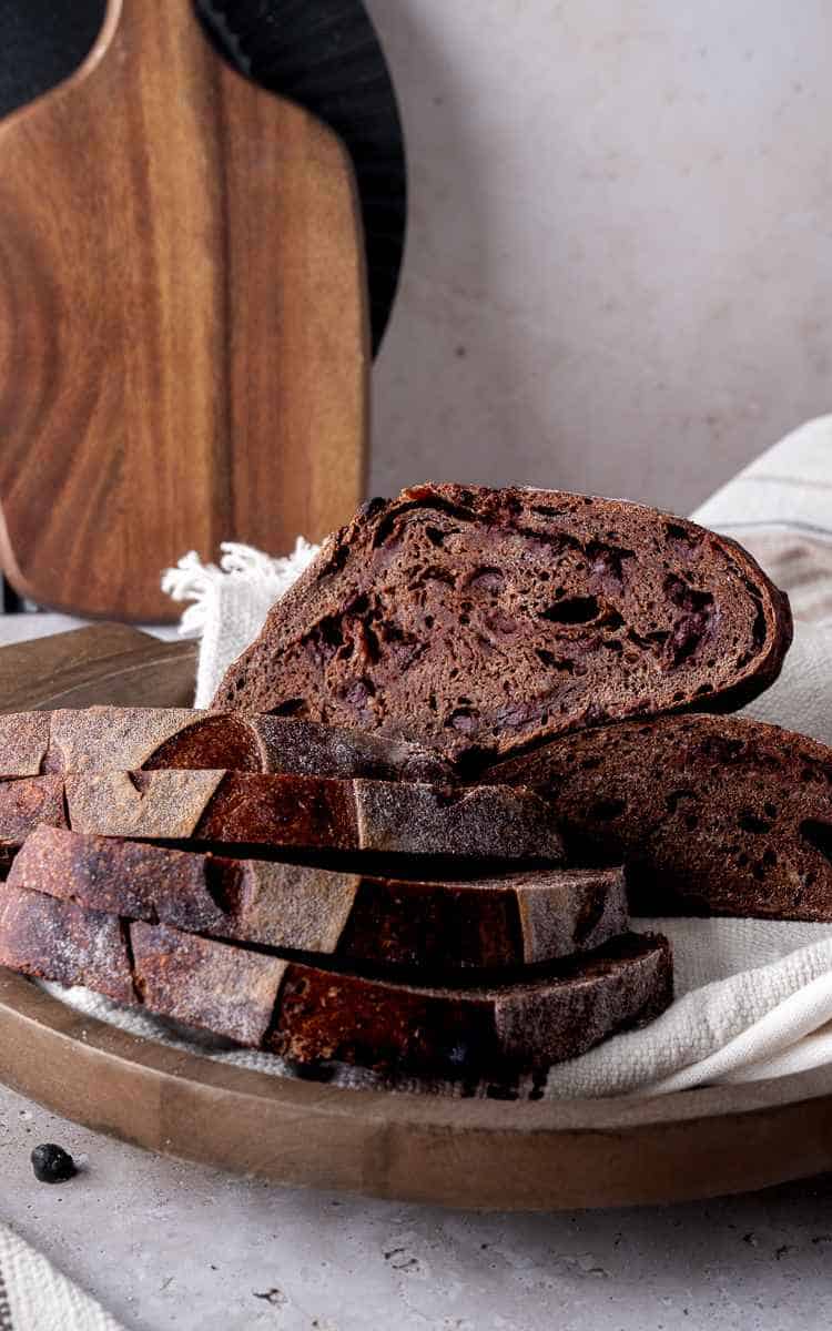 Sliced chocolate sourdough on serving tray.