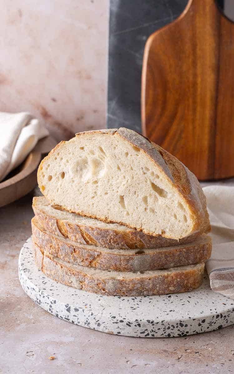 Sliced sourdough and a cut half to show crumb of beginner sourdough.