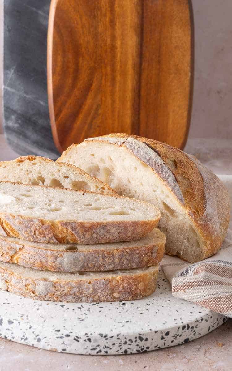 Sliced sourdough bread dusted with rice flour.