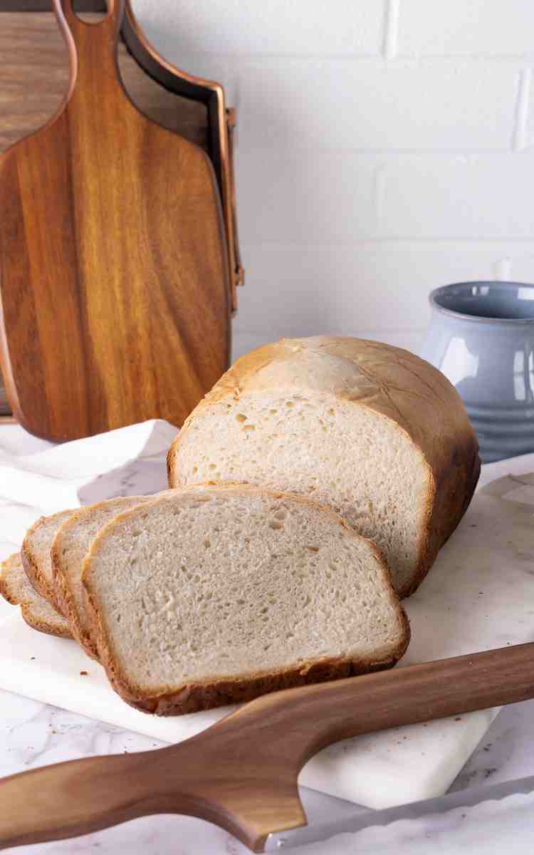 White Bread Machine Bread sliced on marble board.