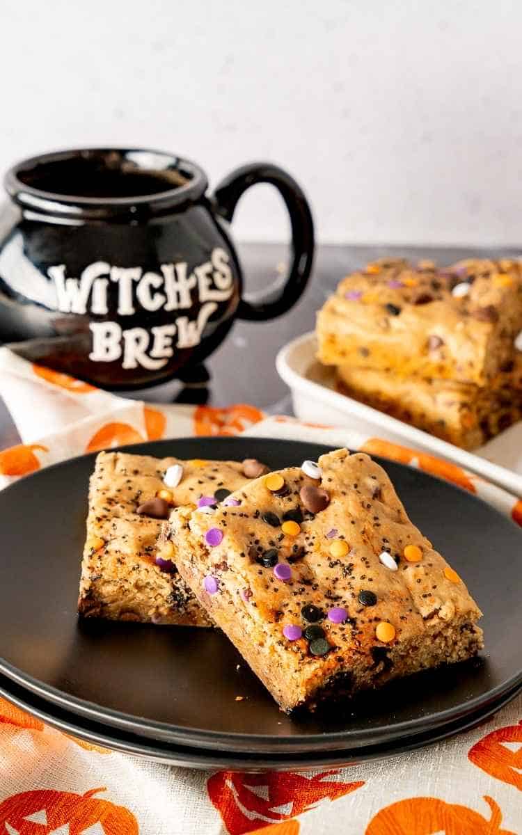 A plate of cookie bars decorated for Halloween.